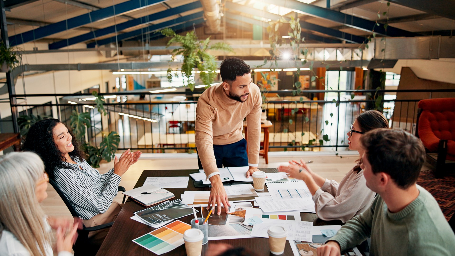 Creative team collaborating in a modern workplace on branding materials