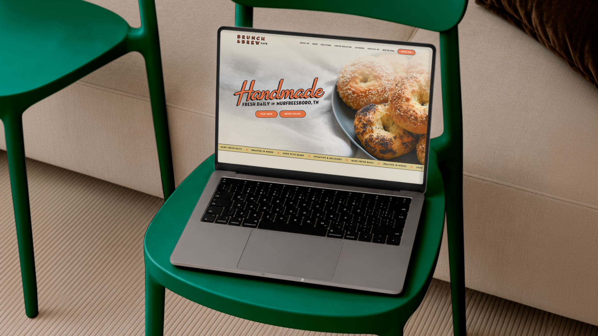 Laptop displaying a professionally designed cafe website with custom branding